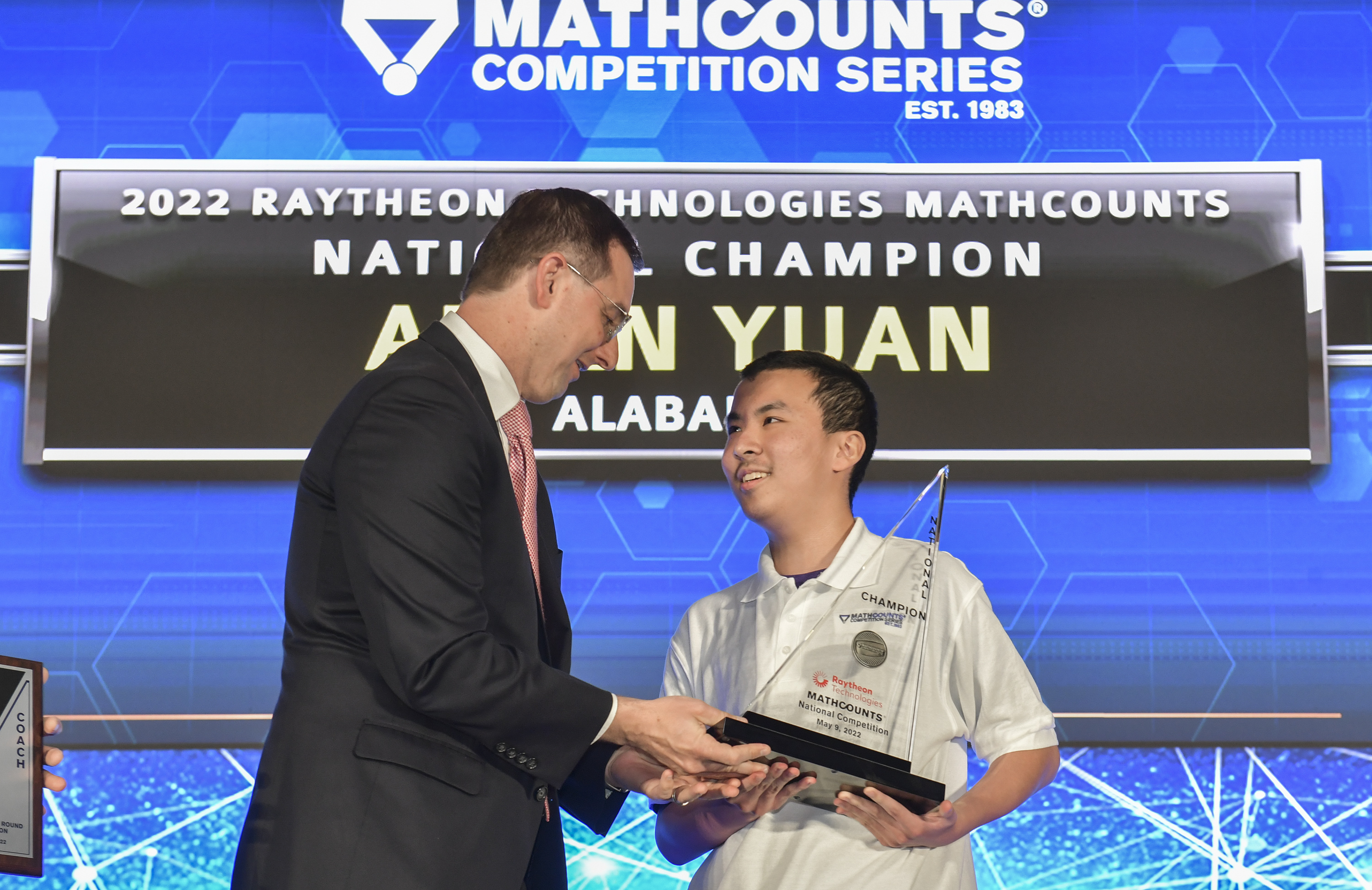 Allan Yuan congratulated by Tracey Gray
