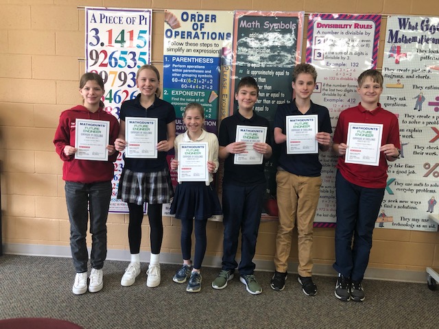 A group of students hold up EWeek certificates